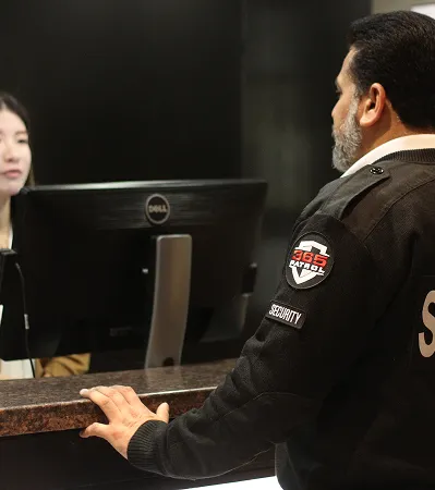 Uniformed 365 Patrol guard providing professional on-site security services and front desk monitoring