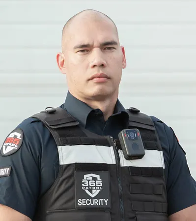 A professional 365 Patrol security guard wearing a tactical vest and body camera, ready to provide expert security service in Calgary.